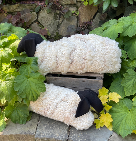 Hand hooked sheep bolster pillows