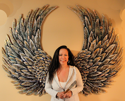 Patricia Taylor Holz with "Tarnished Angel". Patina on copper, gold leaf & enamels on wood. Private commission.